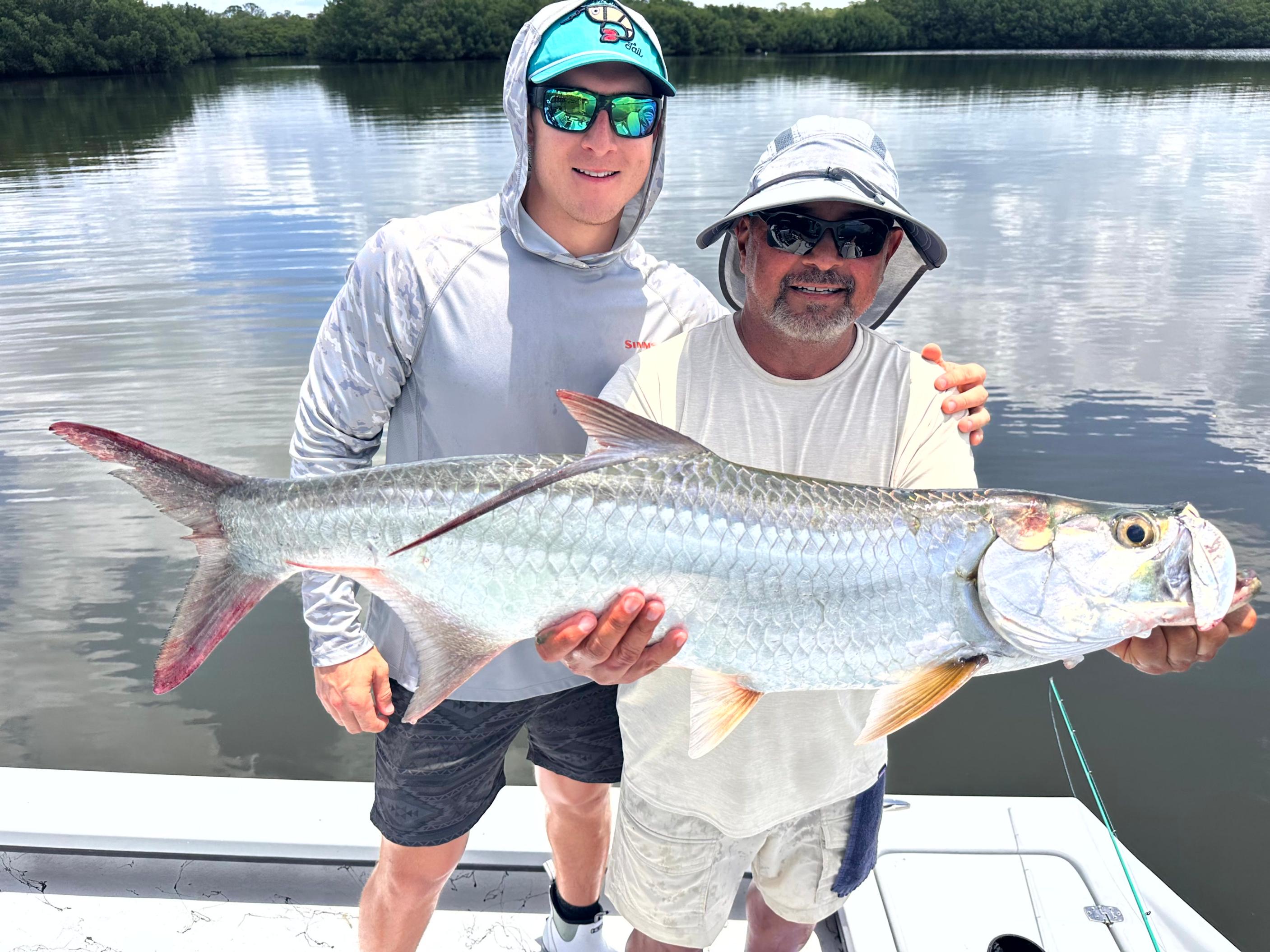 Anglers catching multiple fish species on a Tampa Bay fishing charter